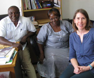 Anna Helland, far right, in the HC3 Monrovia field office with Marietta Yekeh (center) and Teah Doegmah (left)