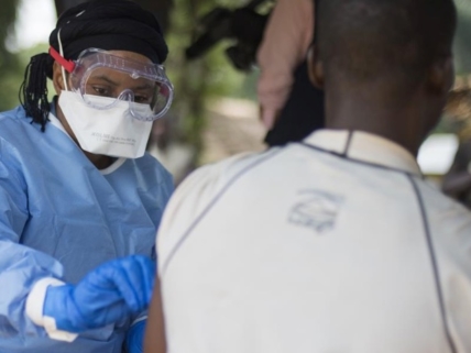 A healthcare worker administering the ebola vaccine